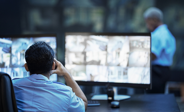 security-guard-in-control-room-man-checking-cctv-
